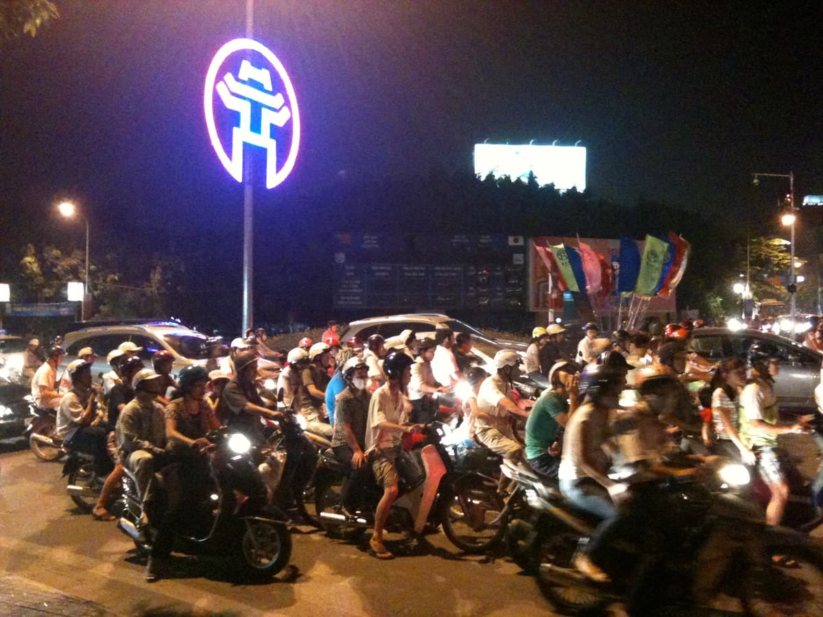Motorbikes and scooters filling a street in central Hanoi