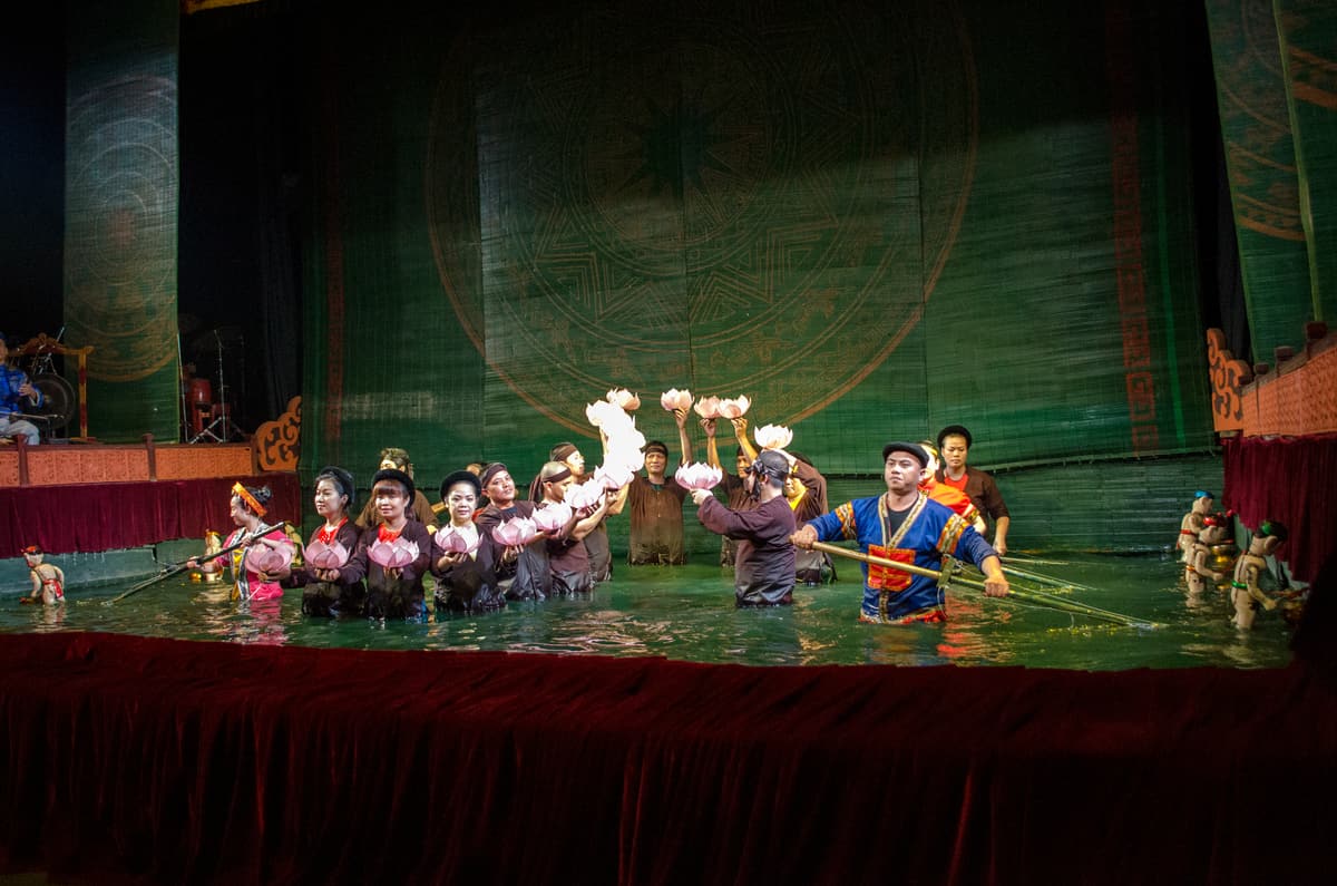 Wooden puppets performing on the water stage of a Hanoi water puppet theatre